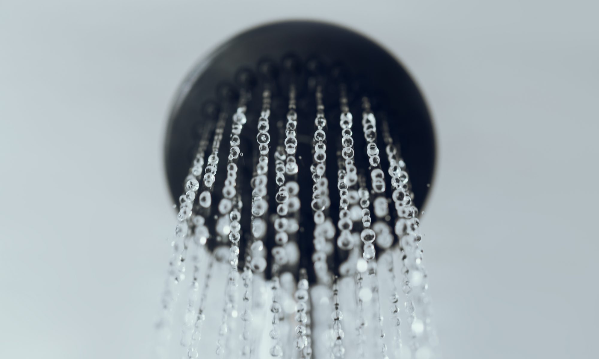 Water coming out of a shower head - camera angle looking up from below